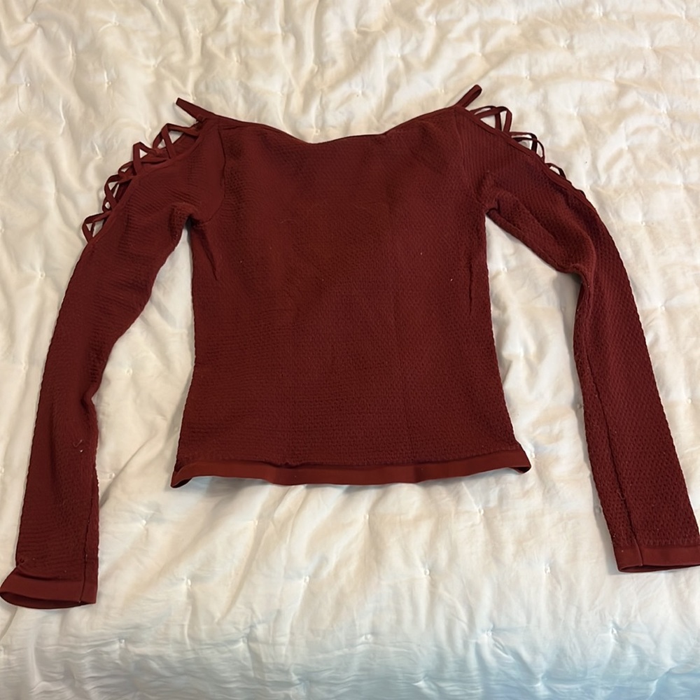 Free people dark red stretchy top with shoulder cutouts in size XS/S